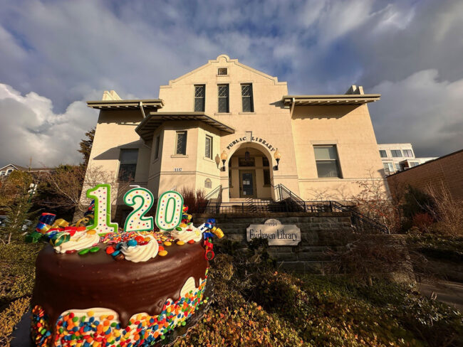 A stuck library with a birthday cake that says 120