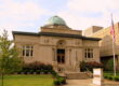 A limestone library with green domes roof