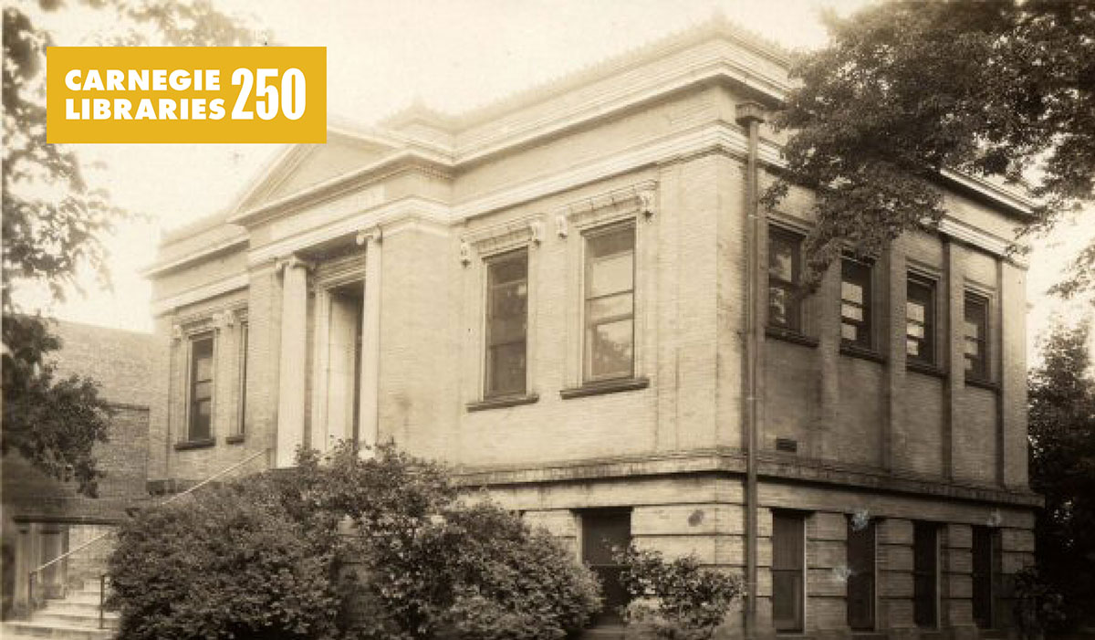 Historic photo of a white brick library.