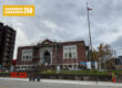 A red brick library building with scaffolding.