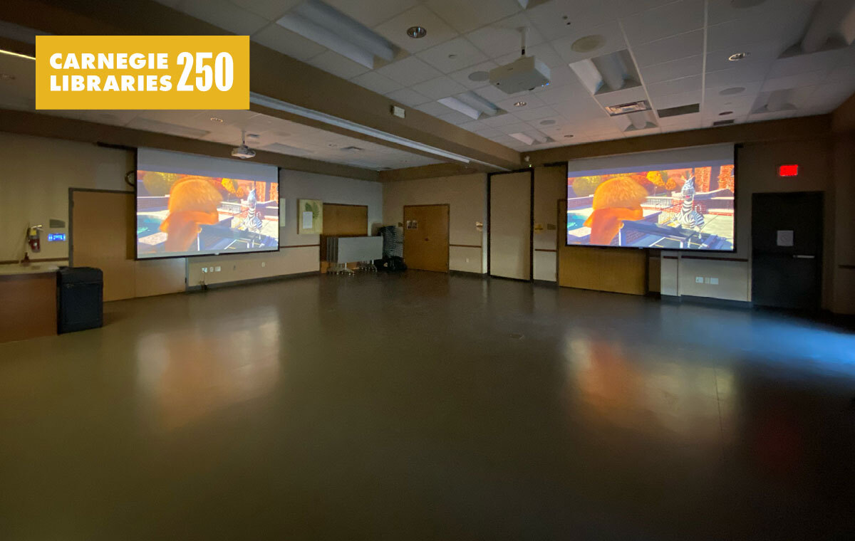 A room with two projector screens
